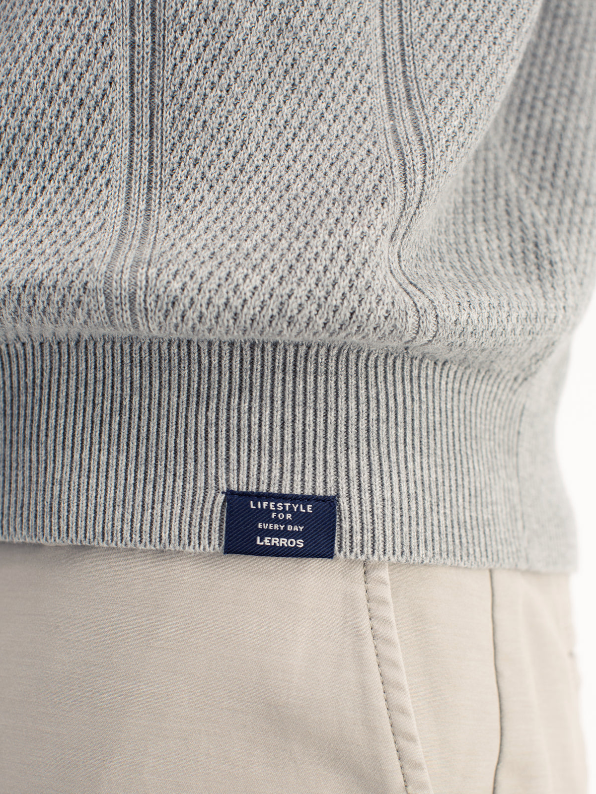 Elegant long-sleeve polo shirt with refined vertical stripes