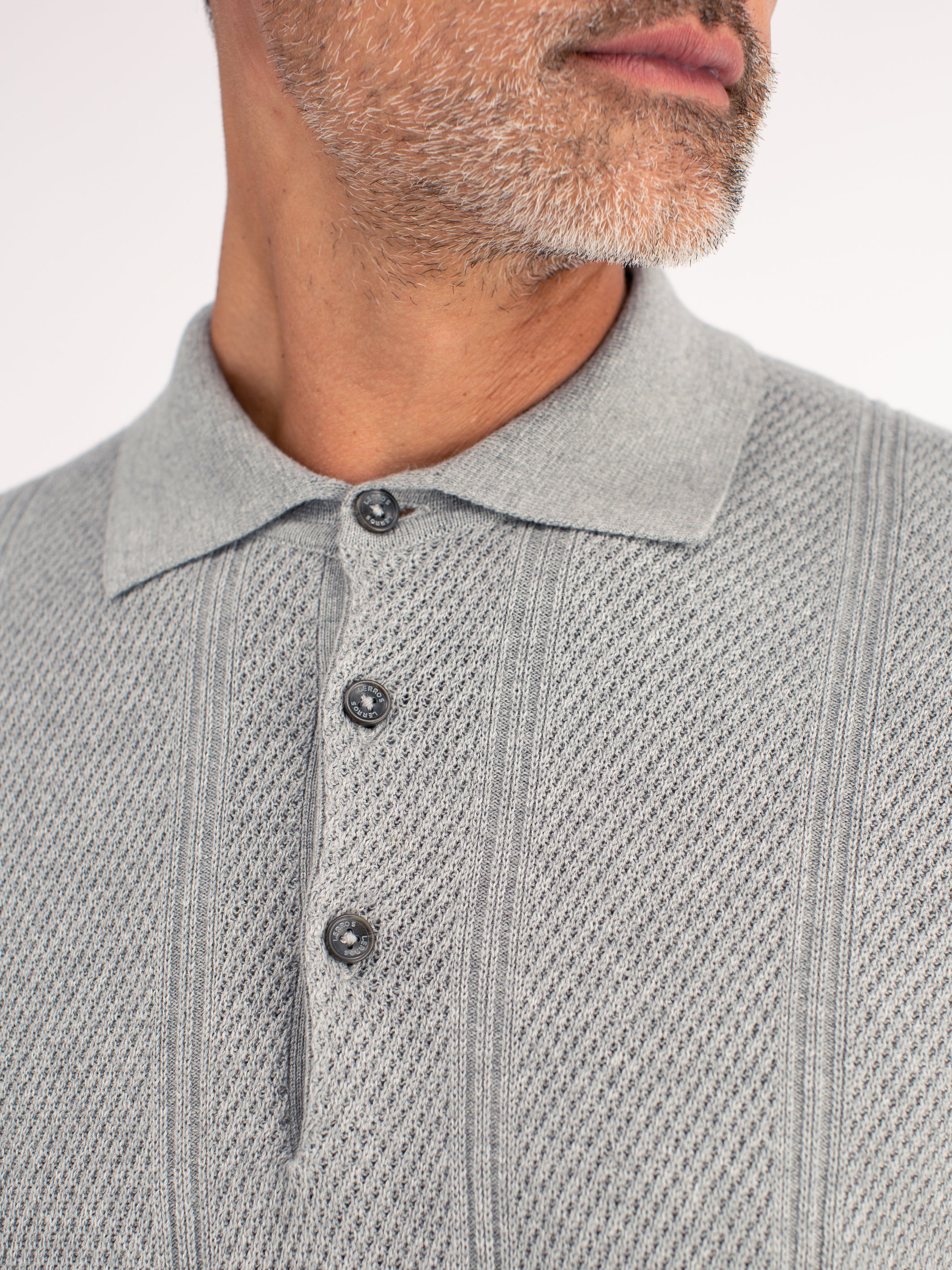 Elegant long-sleeve polo shirt with refined vertical stripes
