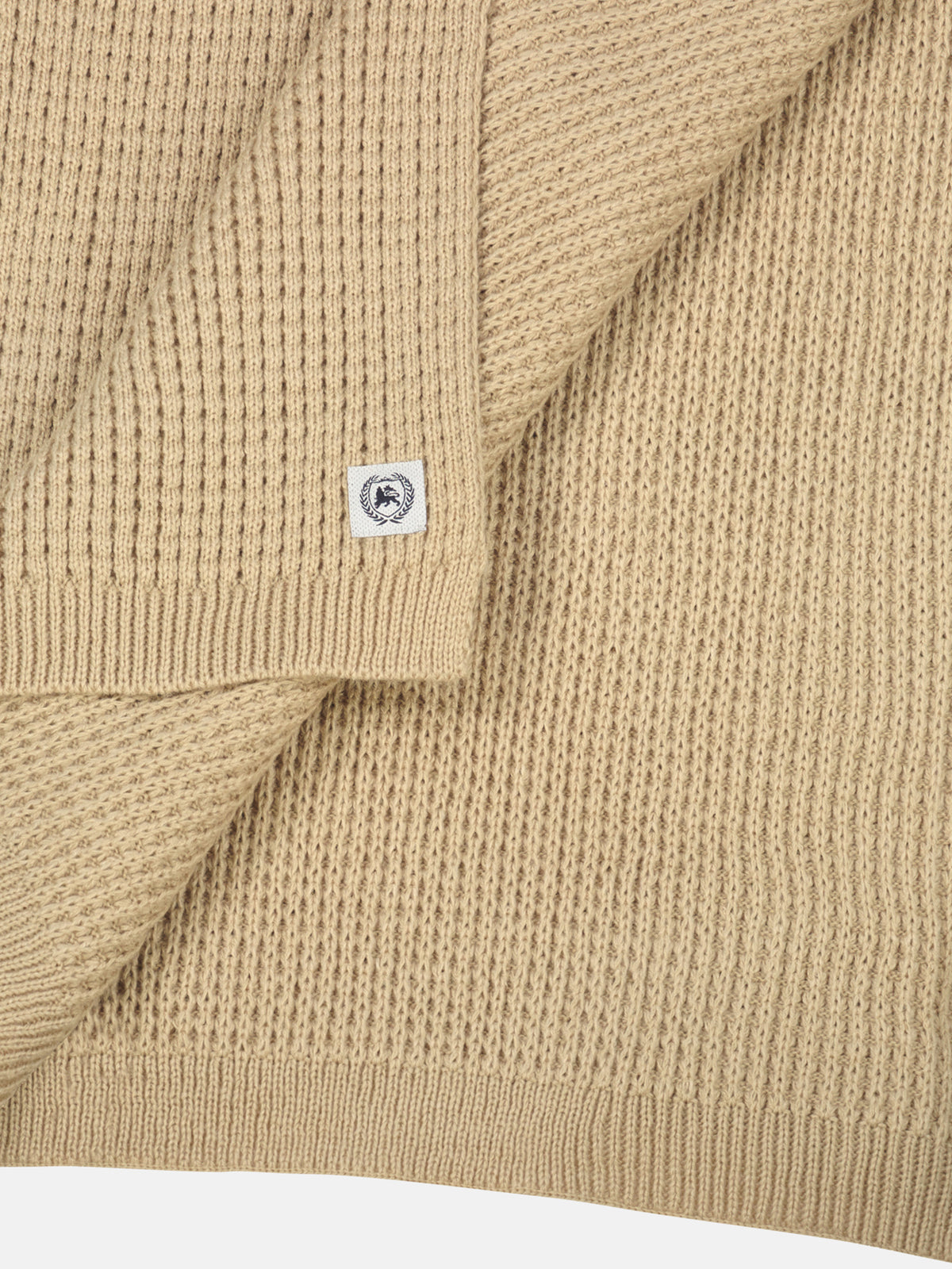 Knitted scarf made of warming synthetic fiber with a flexible structure