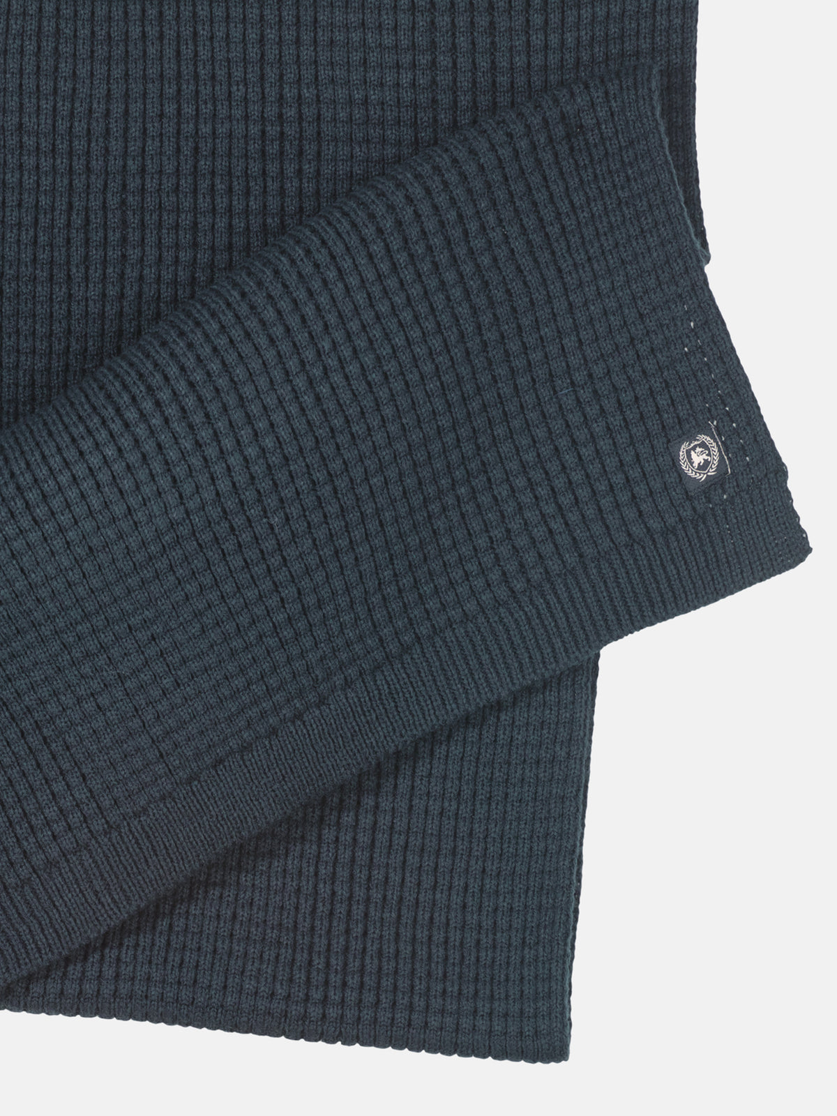 Knitted scarf made of warming synthetic fiber with a flexible structure