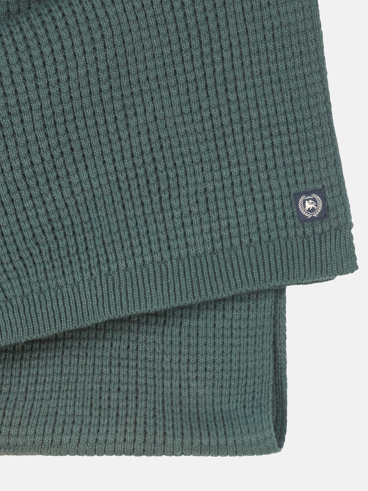 Knitted scarf made of warming synthetic fiber with a flexible structure