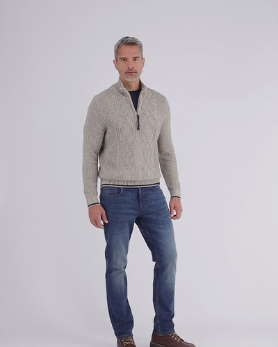 Knitted sweater with cable pattern and turtleneck